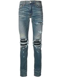 amiri-Blue-Distressed-Skinny-Jeans.jpeg