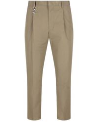 Prada - Pantalones Con Charm Plisado - Lyst