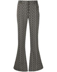 Balmain - Low-Rise Monogram Bootcut Trousers - Lyst