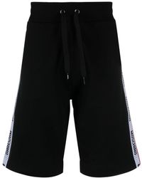 Moschino - Pantalones cortos de chándal con franjas del logo - Lyst