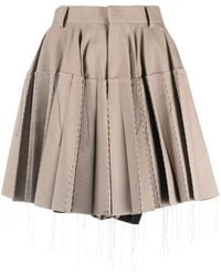 Sacai - Minifalda plisada con costuras expuestas - Lyst