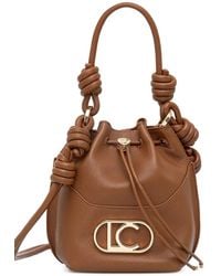 Lola Casademunt - Knot-Detail Logo-Plaque Bucket Bag - Lyst