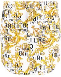 Versace - Logo Couture-print Denim Miniskirt - Lyst