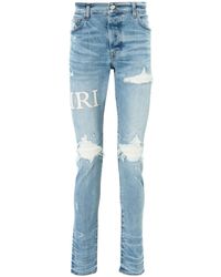 Amiri - MX1 Skinny-Jeans mit Bouclé-Logo - Lyst