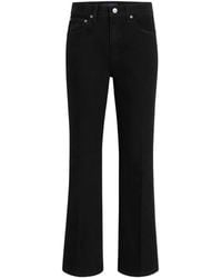 KHAITE - Flared-Leg Cotton Jeans - Lyst