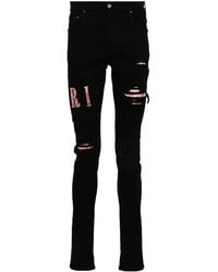 Amiri - Waxed Logo-Appliqué Skinny Jeans - Lyst