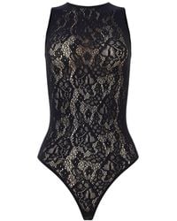 Wolford - Infinite Rose Net Bodysuit - Lyst