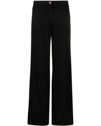 Versace - Pantalon ample à détail de logo - Lyst
