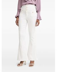 Guess - Button-Embellished Flared Jeans - Lyst