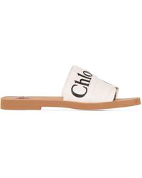 Chloé Woody Slippers Met Geborduurd Logo in het Blauw | Lyst NL