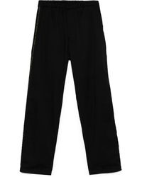 Undercover - Logo Tape-Detail Trousers - Lyst