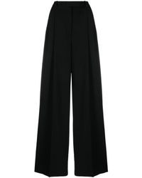 Versace - Pleated Wide-leg Stretch-wool Trousers - Lyst