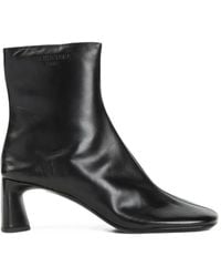 Balenciaga - Duty Free Logo-Embossed Ankle Boots - Lyst