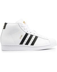 black and white high top adidas shoes
