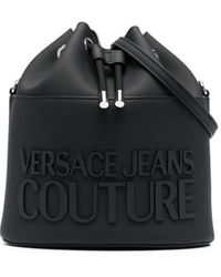 Femme Sacs Sacs seau et sacoches sceau Sac seau tressé à plaque logo Jean Versace Jeans Couture en coloris Noir 