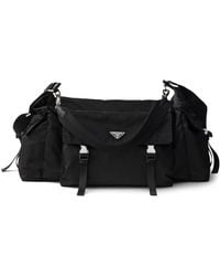Prada - Explore Re-Nylon And Leather Duffel Bag - Lyst