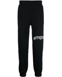 Givenchy - Pantalones de chándal con logo bordado - Lyst