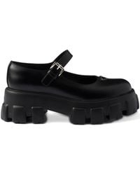 Prada - Logo-Detail Leather Pumps - Lyst