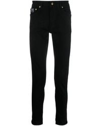Versace - Pantalon en coton à patch logo - Lyst