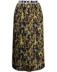 Versace - Falda plisada con logo estampado - Lyst