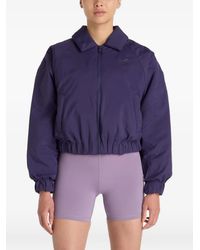 New Balance - Padded Woven Bomber Jacket - Lyst