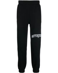 Givenchy - Pantalones de chándal con logo bordado - Lyst