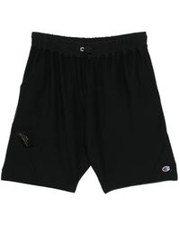 Undercover - X Champion Logo-Embossed Shorts - Lyst