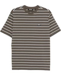 ROTATE BIRGER CHRISTENSEN - Gestreiftes T-Shirt mit Logo-Patch - Lyst