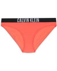 Calvin Klein - Slip bikini con banda logo - Lyst