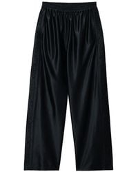 Alexander Wang - Embossed Logo Panel Mid-Rise Track Pants - Lyst