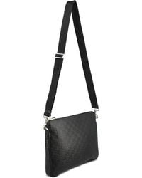 Gucci - Medium Gg Emblem Embossed Clutch Bag - Lyst