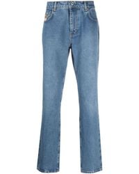 Moschino - Straight-Leg-Jeans mit Logo-Patch - Lyst