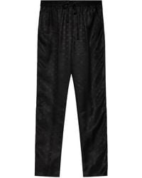 Dolce & Gabbana - Pantalones con logo DG en jacquard - Lyst