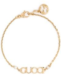 Gucci - Logo-script Glass-pearls Gold-toned Metal Bracelet - Lyst