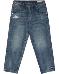 Evisu - Slogan-print Tapered-leg Jeans - Lyst