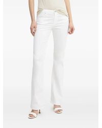 ARMANI EXCHANGE - Jeans Svasati Con Applicazione Logo - Lyst