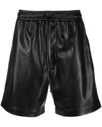 Nanushka - Pantalones cortos de deporte con pliegues - Lyst