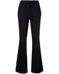 Calvin Klein Pantalones acampanados con franjas laterales - Azul