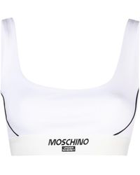 Moschino - Reggiseno sportivo con banda logo - Lyst