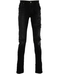 Jeans con strappi decorativi con applicazione serpente da Uomo di Amiri in Blu Lyst