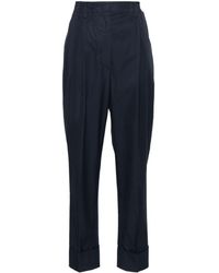 Prada - Pantaloni con pieghe - Lyst