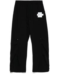 Musium Div. - Logo-Patch Trousers - Lyst