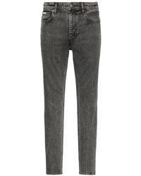 Calvin Klein - Logo-Patch Acid-Wash Jeans - Lyst