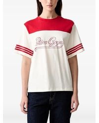Stine Goya - Logo-Print Striped-Sleeve T-Shirt - Lyst