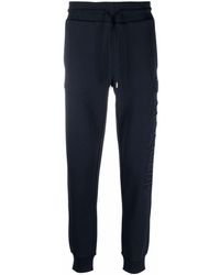 Moncler - Pantalones de chándal con logo bordado - Lyst