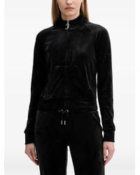 Juicy Couture - Pullover mit Reißverschlusstaschen vorne - Lyst