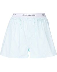 Sporty & Rich - Gestreifte Shorts mit Logo-Bund - Lyst