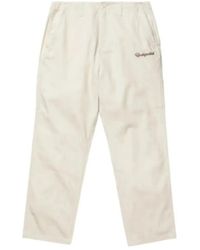 Undefeated - Logo-Embroidered Tapered Trousers - Lyst