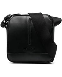 Calvin Klein - Embossed-Logo Messenger Bag - Lyst