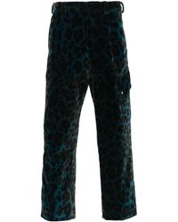 OAMC - Pantalones Combine con estampado de leopardo - Lyst